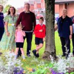 Wigan School’s Vibrant Flower Beds Thrive Through Community Effort